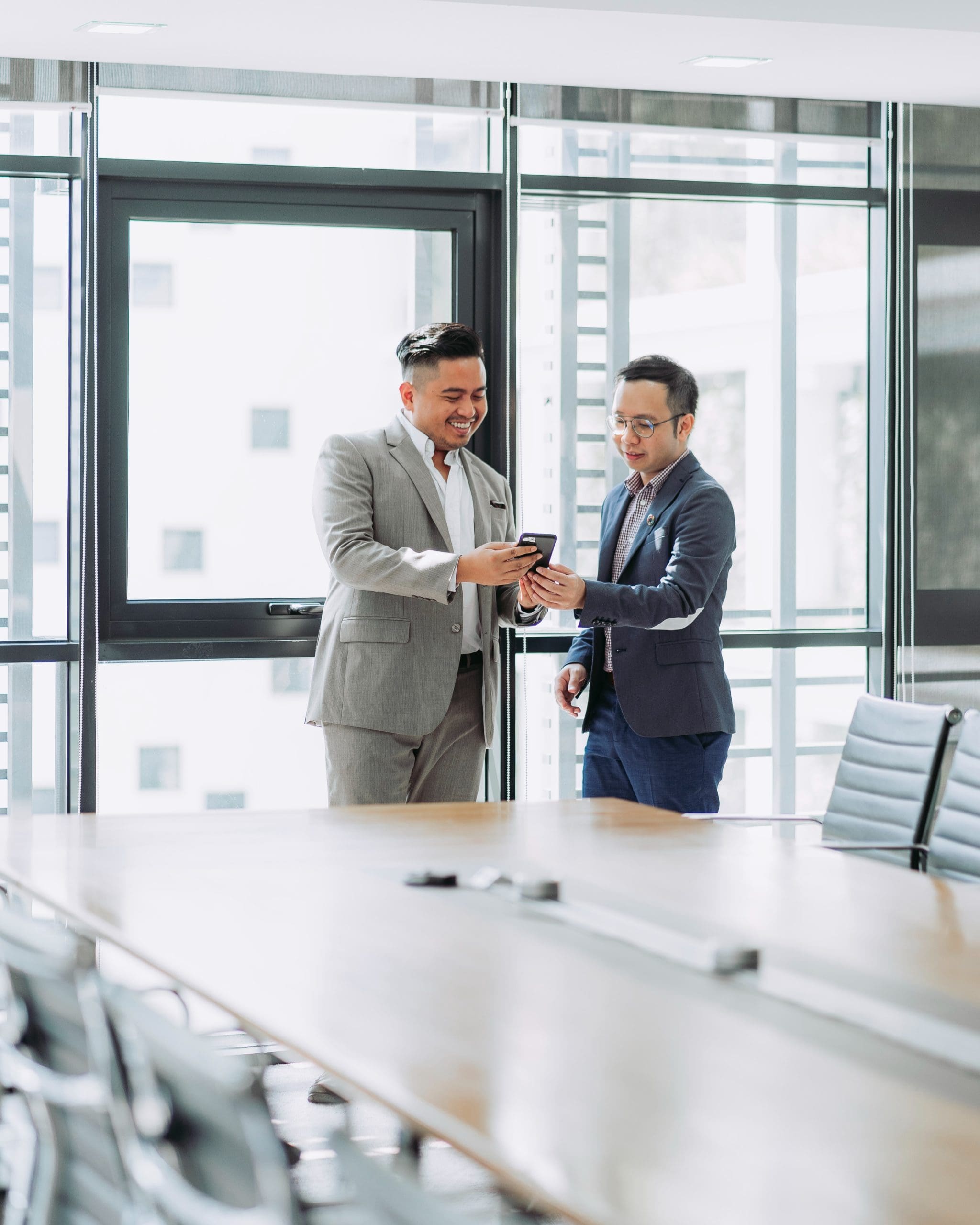 get-found-online two businessmen viewing smartphone